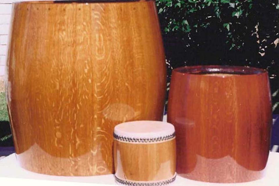 Three newly varnished drum bodies of different sizes